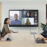 AI-powered smart camera auto-framing participants in a virtual meeting.