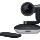 A black Logitech pan-tilt-zoom (PTZ) camera with its lens prominently displayed, used for video conferencing.